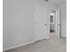 A bedroom features neutral walls, carpeted flooring, and a door leading to the bathroom at 142 Morning View Way, Moncks Corner, SC 29461