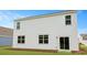 Spacious backyard featuring healthy lawn, complemented by a sliding glass door for easy indoor-outdoor access at 148 Morning View Way, Moncks Corner, SC 29461