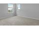 This bedroom has two windows with views of the outdoors at 148 Morning View Way, Moncks Corner, SC 29461