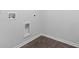 This laundry room has luxury vinyl plank flooring and white walls at 148 Morning View Way, Moncks Corner, SC 29461