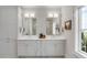 Elegant bathroom with double sinks, modern fixtures, and stylish cabinetry at 34 Waterway Island Dr, Isle of Palms, SC 29451