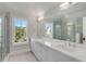 Spacious bathroom features a long vanity with double sinks and a glass-enclosed shower at 34 Waterway Island Dr, Isle of Palms, SC 29451