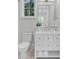 Updated bathroom with a vanity and an elegant mirror, plus modern fixtures and ample storage at 34 Waterway Island Dr, Isle of Palms, SC 29451