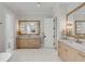 Expansive bathroom boasting dual vanities with marble countertops, designer fixtures, and a spa-like atmosphere at 34 Waterway Island Dr, Isle of Palms, SC 29451