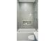 Bathtub with tile surround, shelf, and modern fixtures creates a serene and spa-like ambiance at 34 Waterway Island Dr, Isle of Palms, SC 29451