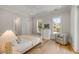 Light-filled bedroom featuring a chair, dresser, and view to the exterior at 34 Waterway Island Dr, Isle of Palms, SC 29451