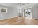 Sunlit bedroom with double doors, hardwood floors, a ceiling fan and large windows offering ample natural light at 34 Waterway Island Dr, Isle of Palms, SC 29451