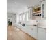 Hallway with bench seating, countertops, and sink shows the seamless design and function at 34 Waterway Island Dr, Isle of Palms, SC 29451