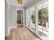 Hallway provides access to the deck and showcases an open floor plan with plenty of natural light at 34 Waterway Island Dr, Isle of Palms, SC 29451