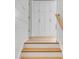 Bright hallway features hardwood floors, shiplap walls, and custom built-in storage at 34 Waterway Island Dr, Isle of Palms, SC 29451