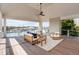 Expansive covered porch offering stunning views, comfortable seating, and a relaxing ambiance at 34 Waterway Island Dr, Isle of Palms, SC 29451