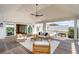 Large outdoor porch with comfortable seating offering lovely views of the neighborhood at 34 Waterway Island Dr, Isle of Palms, SC 29451