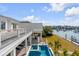 Beautiful elevated outdoor area featuring a swimming pool, patio, and harbor views at 34 Waterway Island Dr, Isle of Palms, SC 29451