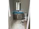 Bathroom features a wood vanity with a mirror, toilet, and white and gray geometric tile flooring at 1560 John Fenwick Ln, Johns Island, SC 29455
