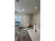 Bathroom with a marble tiled shower, soaking tub, and vanity with modern fixtures, under construction at 1560 John Fenwick Ln, Johns Island, SC 29455