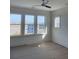 Bright bedroom with a large window offering scenic views and a ceiling fan at 1560 John Fenwick Ln, Johns Island, SC 29455