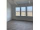 Bright bedroom featuring a large window with scenic field views at 1560 John Fenwick Ln, Johns Island, SC 29455