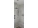 Luxurious shower with rainfall showerhead, handheld sprayer, seat, and marble-look tile at 1560 John Fenwick Ln, Johns Island, SC 29455