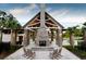 Outdoor fireplace with rocking chairs, perfect for relaxing evenings at 3837 Delinger Dr, Mount Pleasant, SC 29466