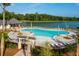 Resort-style pool with plenty of lounge chairs and lake views at 3837 Delinger Dr, Mount Pleasant, SC 29466