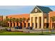 Wando High School exterior, brick building with palm trees and cars in parking lot at 3837 Delinger Dr, Mount Pleasant, SC 29466