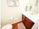 Clean bathroom with dark wood vanity and white countertop at 8897 Cat Tail Pond Rd, Summerville, SC 29485