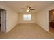 Spacious bedroom with wall-to-wall carpeting and ceiling fan at 8897 Cat Tail Pond Rd, Summerville, SC 29485