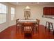 Bright dining room featuring hardwood floors and a round table at 8897 Cat Tail Pond Rd, Summerville, SC 29485