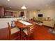 Open dining area with hardwood floors and view into living room at 8897 Cat Tail Pond Rd, Summerville, SC 29485