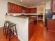 Modern kitchen with dark wood cabinets and granite countertops at 8897 Cat Tail Pond Rd, Summerville, SC 29485