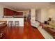 Open kitchen with hardwood floors and breakfast bar at 8897 Cat Tail Pond Rd, Summerville, SC 29485