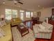 Spacious living room with hardwood floors and lots of natural light at 8897 Cat Tail Pond Rd, Summerville, SC 29485