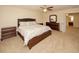 Main bedroom with king bed, dresser and ensuite bathroom at 8897 Cat Tail Pond Rd, Summerville, SC 29485