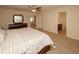 Main bedroom with king bed and access to private bathroom at 8897 Cat Tail Pond Rd, Summerville, SC 29485