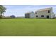 Large backyard with a well-manicured lawn between two houses at 132 Morning View Way, Moncks Corner, SC 29461