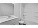 Bright bathroom featuring a single sink vanity, toilet and tub with shower in neutral tones at 132 Morning View Way, Moncks Corner, SC 29461