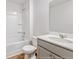 Clean bathroom with gray vanity, white tub, and tile flooring at 132 Morning View Way, Moncks Corner, SC 29461