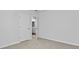 An empty bedroom featuring a light colored carpet, base trim, neutral wall paint and two doors at 132 Morning View Way, Moncks Corner, SC 29461