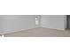 An empty bedroom featuring a light colored carpet and base trim, window and a neutral wall paint at 132 Morning View Way, Moncks Corner, SC 29461