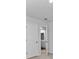 An empty bedroom featuring a light colored carpet, base trim, neutral wall paint and two doors at 132 Morning View Way, Moncks Corner, SC 29461