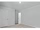 An empty bedroom featuring a light colored carpet, base trim, neutral wall paint and two doors at 132 Morning View Way, Moncks Corner, SC 29461