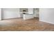 Open dining area with wood-look flooring and kitchen views at 132 Morning View Way, Moncks Corner, SC 29461
