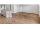 Spacious dining area with wood-look flooring adjacent to kitchen at 132 Morning View Way, Moncks Corner, SC 29461