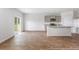 Open concept dining area with wood-look flooring and kitchen access at 132 Morning View Way, Moncks Corner, SC 29461