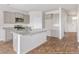 Modern kitchen with gray cabinets, granite countertops, and island at 132 Morning View Way, Moncks Corner, SC 29461