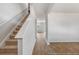 Modern staircase with carpeted steps and wood flooring at 132 Morning View Way, Moncks Corner, SC 29461