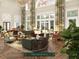 Grand hall with hardwood floors, large windows, and comfortable seating at 609 King St # 704, Charleston, SC 29403