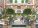 Landscaped courtyard with seating areas and a central fountain at 609 King St # 747, Charleston, SC 29403