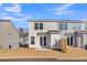 Tan and gray townhome exterior with back patio and small yard at 400 Green Fern Dr, Summerville, SC 29483