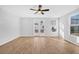 Bright living room featuring hardwood floors and sliding glass doors to backyard at 400 Green Fern Dr, Summerville, SC 29483